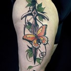 dagger_butterfly_thigh_tattoo.jpg